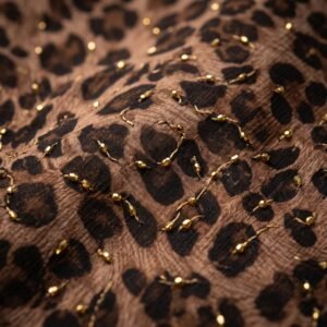 Chiffon Cut Dana Work 44 – Leopard Print Chiffon with Gold Bead Work – close-up of gold cut dana beads